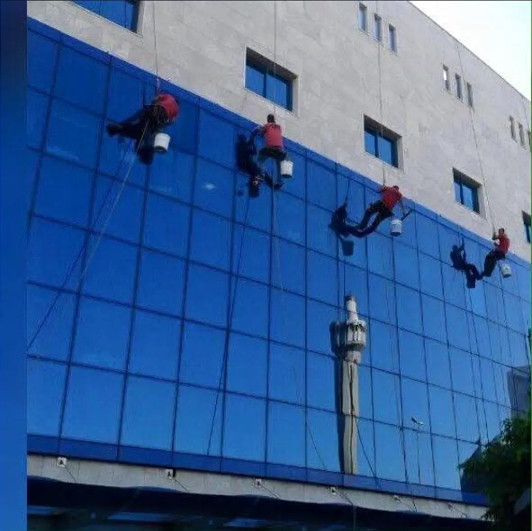 Younes Cleaning rope-access team cleaning a glass tower