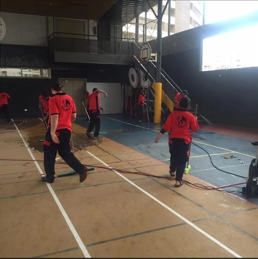 Washing a school gym floor