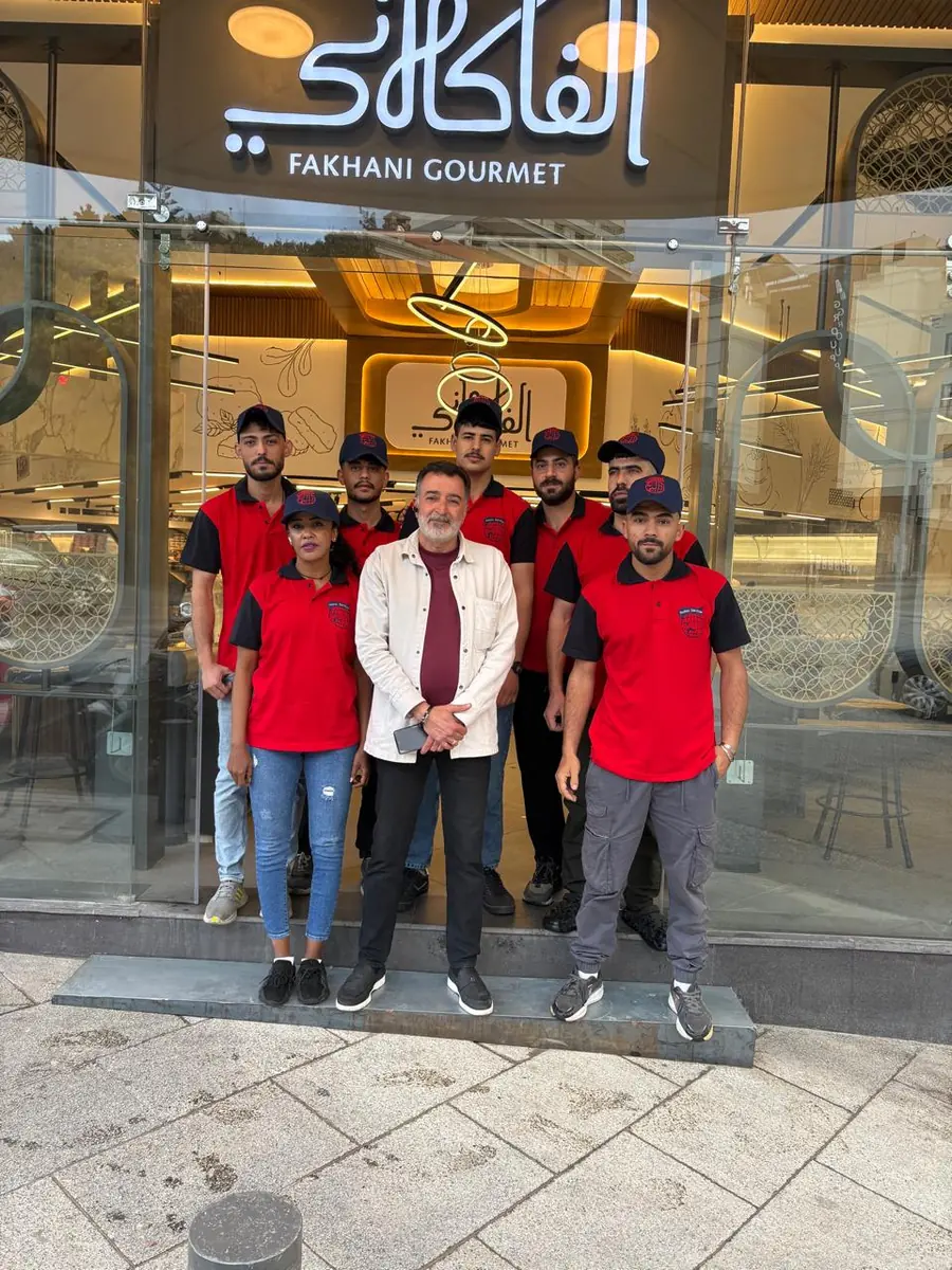Cleaning team in front of a client store