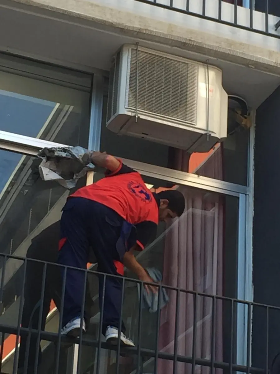 Cleaning windows and air-conditioning units
